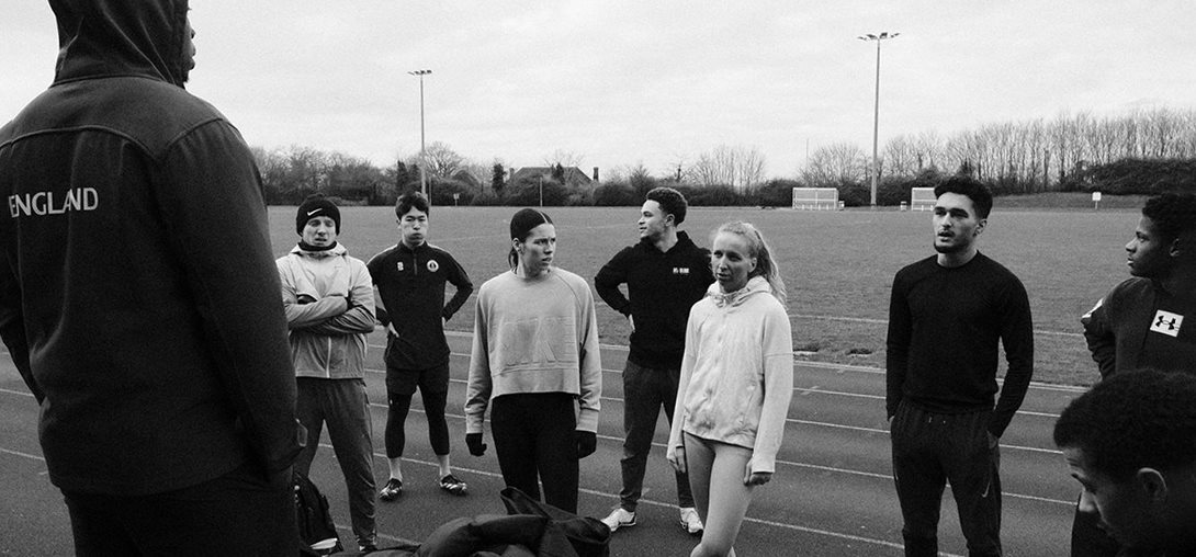 Athlete sprinting on an indoor track